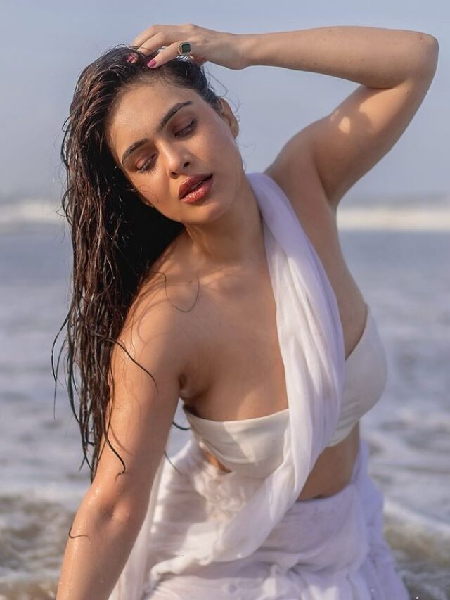 Seductive Poses Of wet Neha Malik in white saree at beach