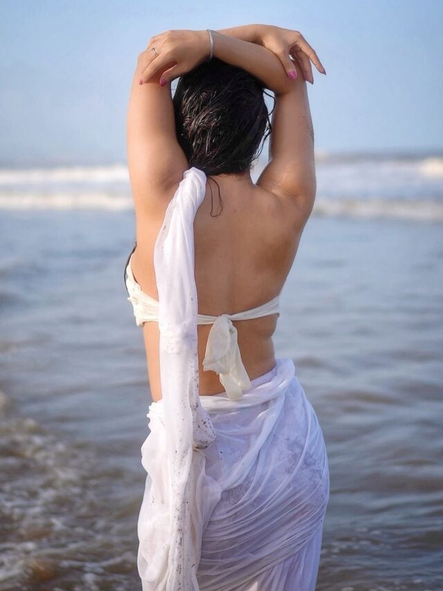 Hot and Wet Look Of Neha Malik in White Saree Created Buzz as she flaunts her Sensual curves On the beach