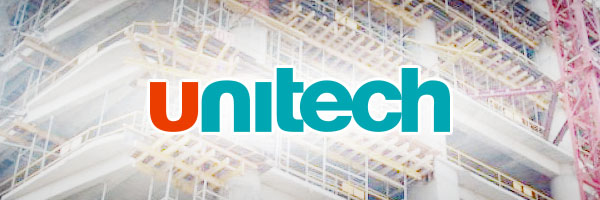 Unitech की Q1 FY26 रिपोर्ट: वित्तीय नुकसान कम हुआ, लेकिन राजस्व अभी भी दबाव में