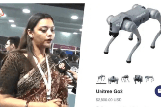 Woman discussing robotic technology showcase.
