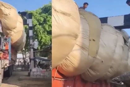 overloaded-truck-stuck-railway-crossing-viral-video-india-hindi