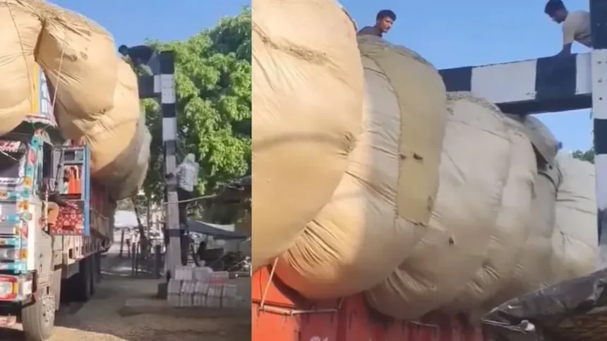 overloaded-truck-stuck-railway-crossing-viral-video-india-hindi