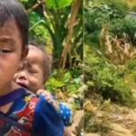 nepal-floods-little-boy-carries-sister-searching-missing-parents