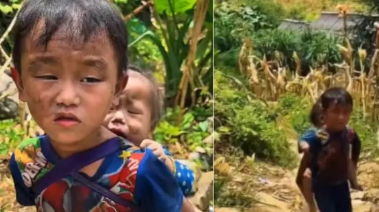 nepal-floods-little-boy-carries-sister-searching-missing-parents