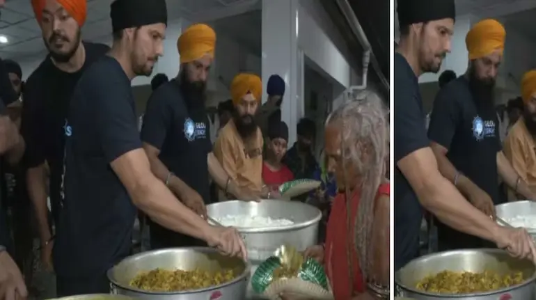 randeep-hooda-assam-flood-relief-food-distribution-shivsagar